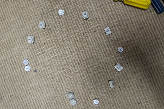Cutout numbers positioned on carpet to represent clock.