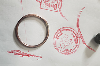 Drawing of jewelry made from fax machine parts.